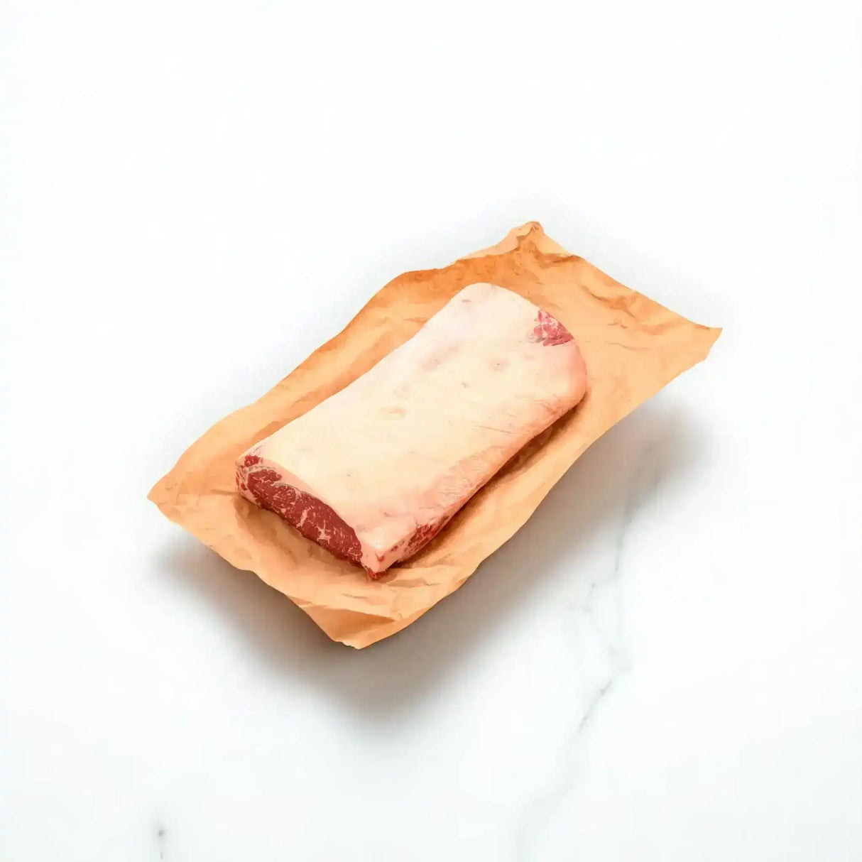 Whole Angus sirloin steak on butcher paper, showcasing premium Australian beef cut