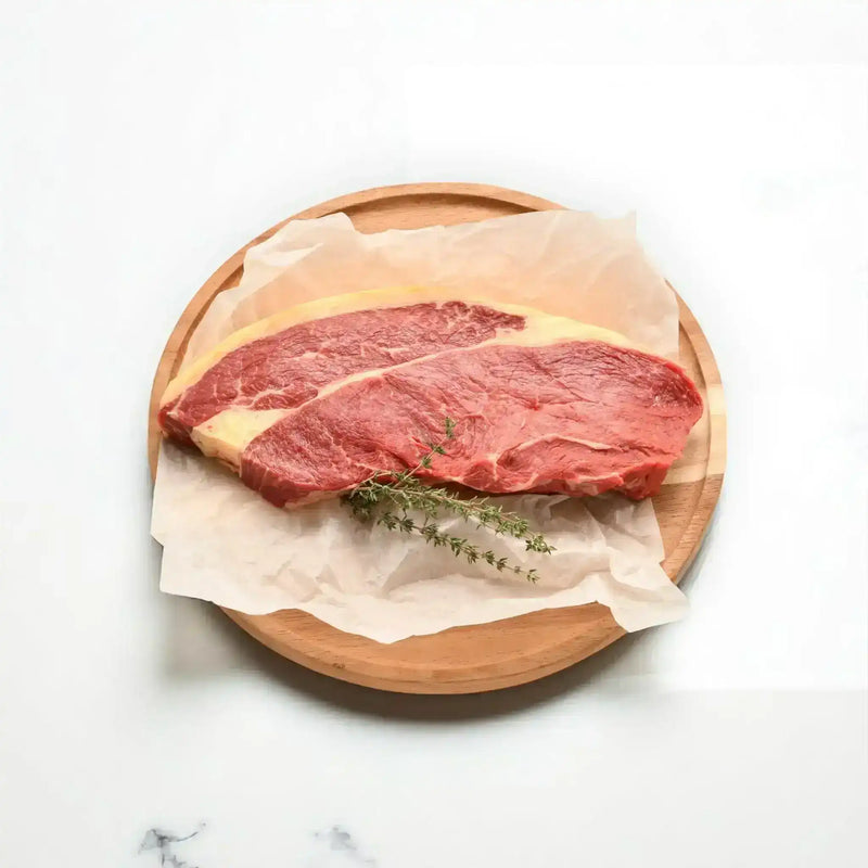 Peter Augustus rump steak on parchment with fresh herbs, premium Australian beef