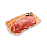 Fresh grass-fed beef brisket on butcher paper with salt and pepper, premium Australian meat
