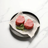 Premium Australian Wagyu eye fillet steaks on parchment with fresh sage, Peter Augustus