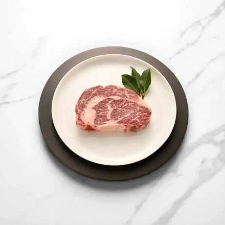 Premium Australian Wagyu rib fillet steak with marbling on a plate, Peter Augustus Craft Butcher