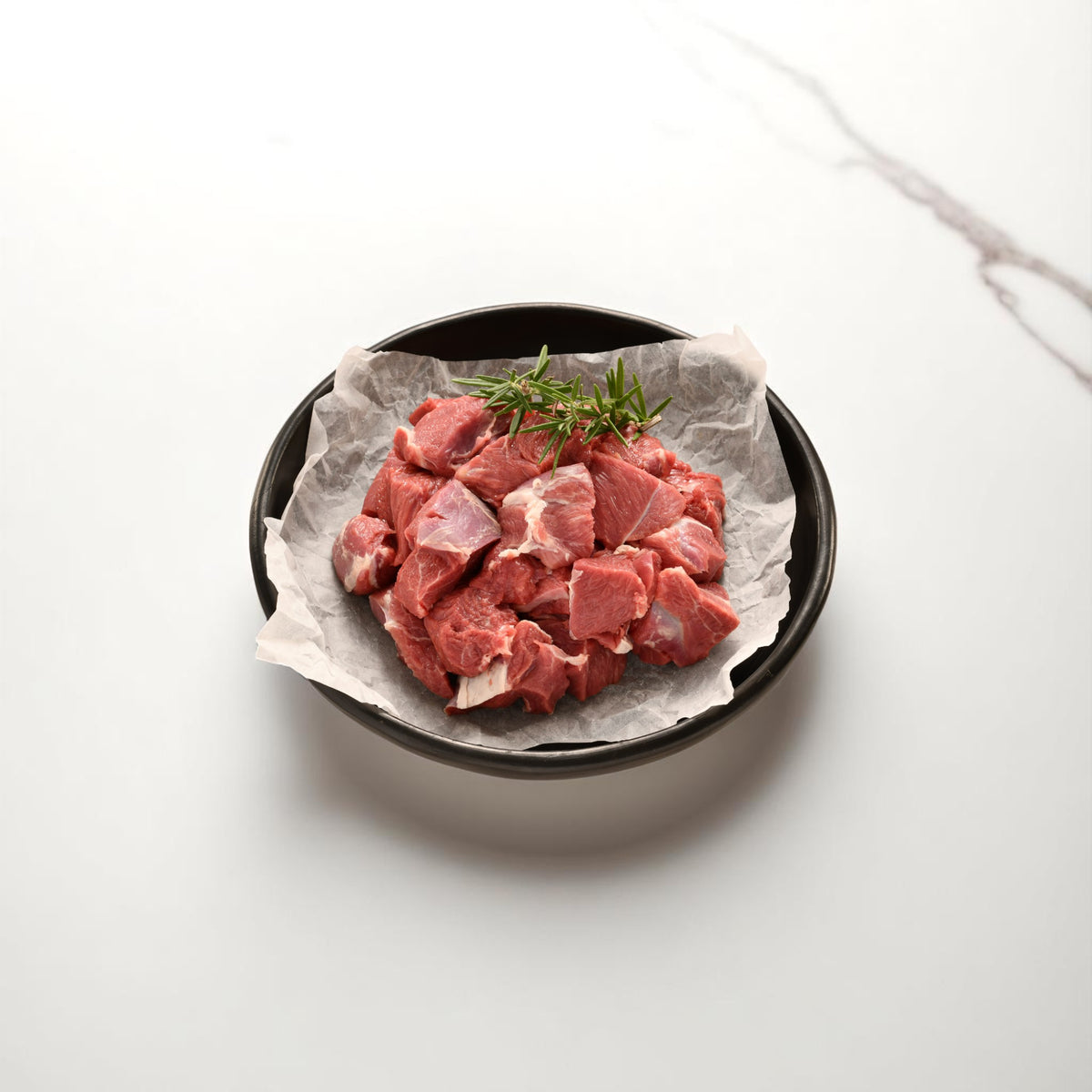 Raw diced lamb portions from Peter Augustus – perfect for slow cooking or skewers.