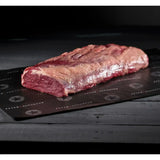 Raw grain-fed rib fillet steak on black butcher paper, premium Australian beef cut