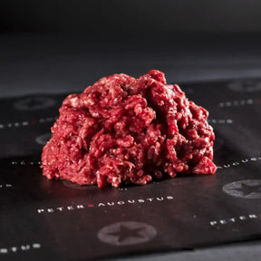 Fresh Australian beef mince on black butcher paper