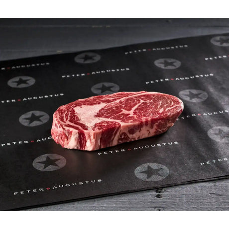Premium marbled Australian beef steak from Peter Augustus Craft Butcher on branded paper