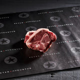 Premium Peter Augustus beef steak cut on branded butcher paper