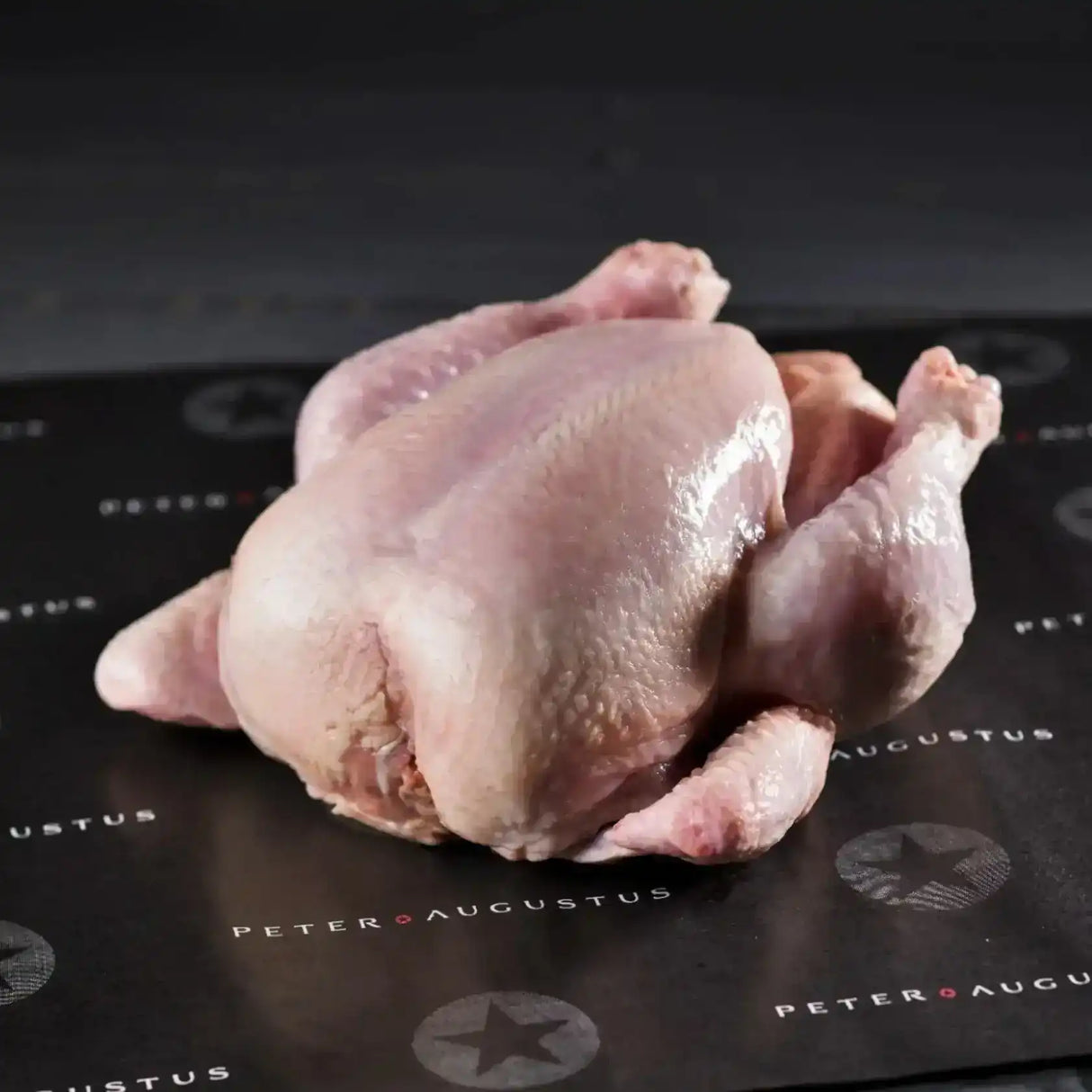 Whole free range chicken from Peter Augustus Craft Butcher on branded butcher paper