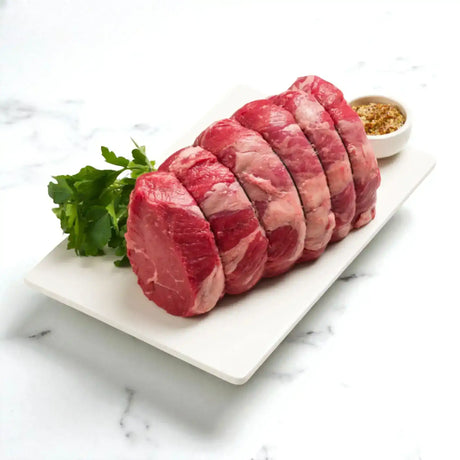 Peter Augustus Angus rump roast on platter with parsley and spice, premium Australian beef