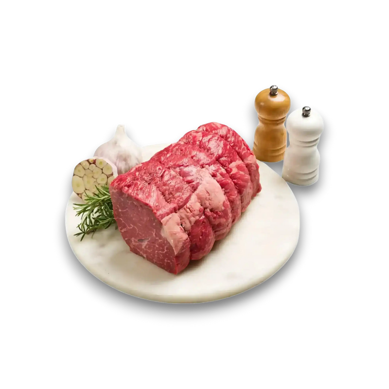 Fresh grass-fed beef roast with garlic, rosemary, salt and pepper on marble plate