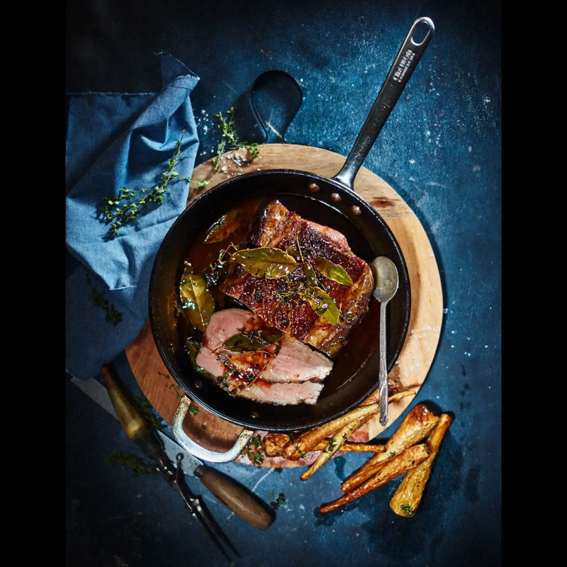 Roast Australian beef in a skillet with herbs, served with roasted vegetables, Peter Augustus