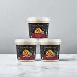 Three 2kg tubs of Diamantina Wagyu beef tallow stacked on a marble surface