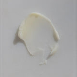 Smooth smear of creamy wagyu beef tallow on a white background