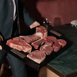 Assortment of Australian Wagyu and Angus beef cuts on a butcher's board at Peter Augustus