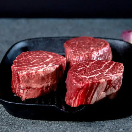 Premium Australian Wagyu beef steaks in a cast iron pan by Peter Augustus Craft Butcher