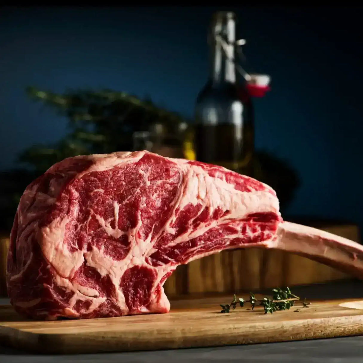 Raw Wagyu Tomahawk steak on wooden board, marbled beef, gourmet meat, closeup