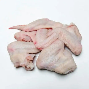 Raw chicken wings on white background, fresh poultry meat for cooking or grilling